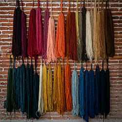 Yarn Hanging on a Brick Wall